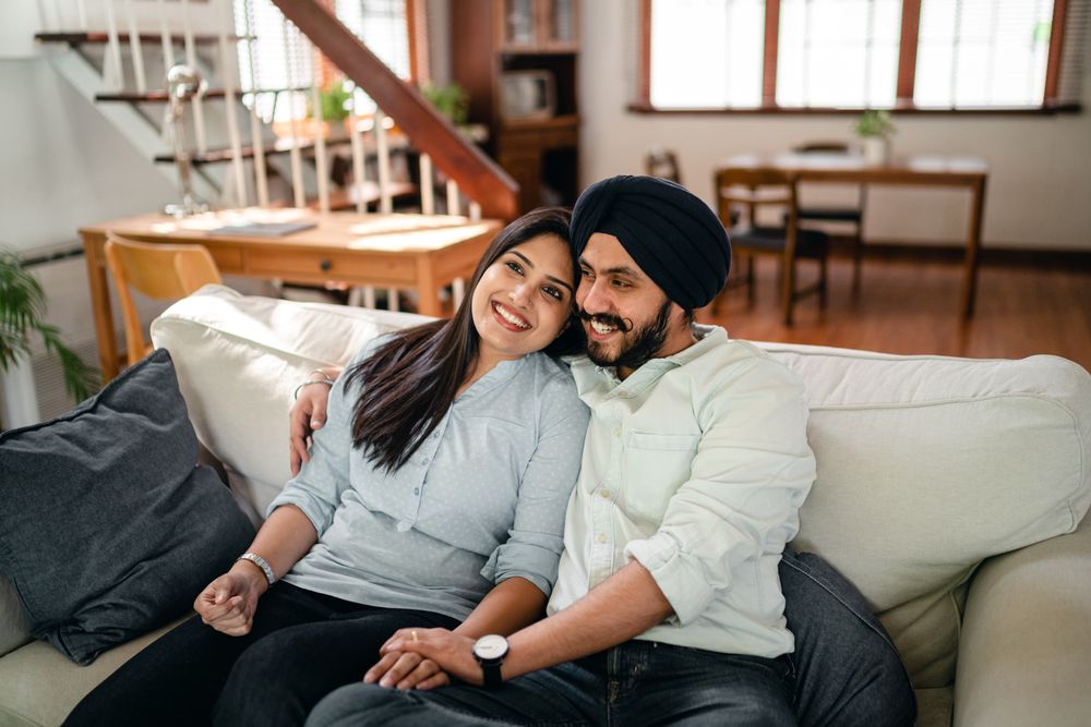 Couple embracing warmly at home